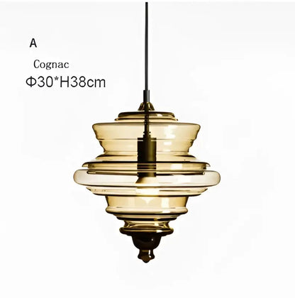 Modern gold and white decorbites glass chandelier featuring a cognac-colored tiered glass pendant light with sleek design