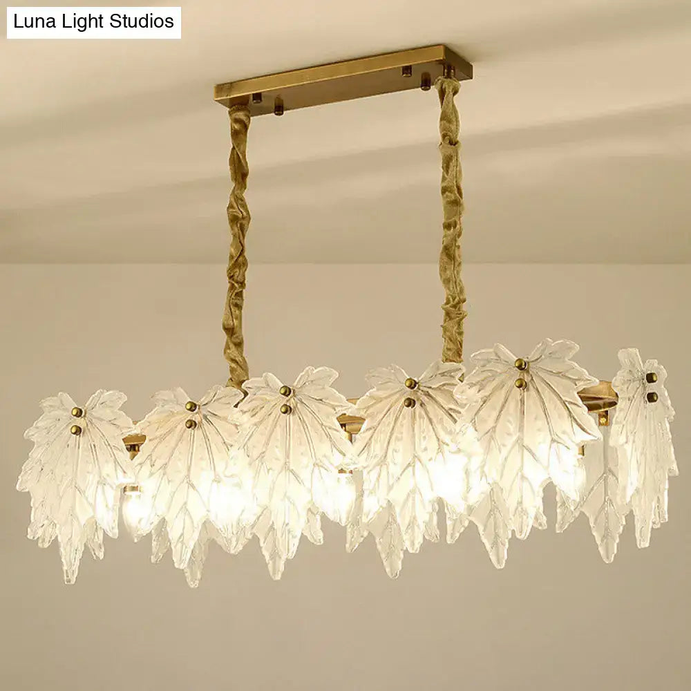 Modern gold and white glass floral pendant light fixture with leaf-shaped white glass shades for dining room use