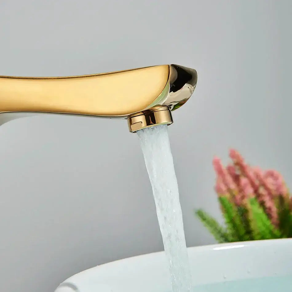 Modern gold angular basin faucet with sleek curved spout and polished finish for decorbites black bronze bathroom decor