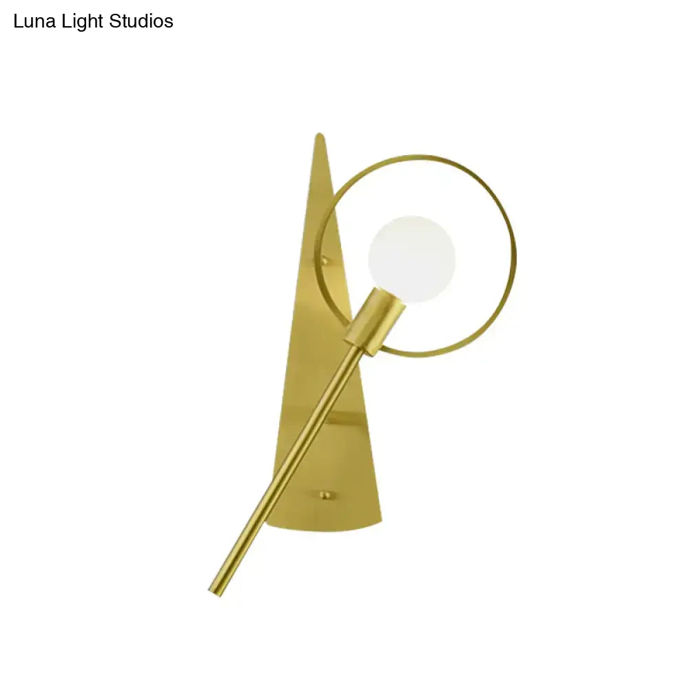 Modern gold angular ring sconce light fixture with sleek backplate and circular ring framing bulb for bedroom use
