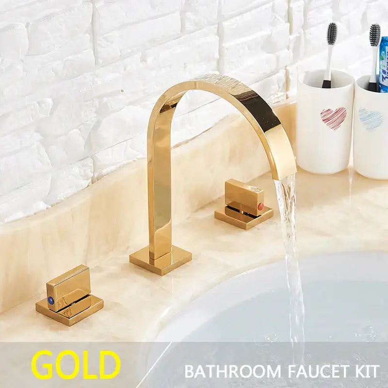 Modern gold arched dual handle basin faucet set featuring a gold-finished basin faucet with an arched spout and square handles