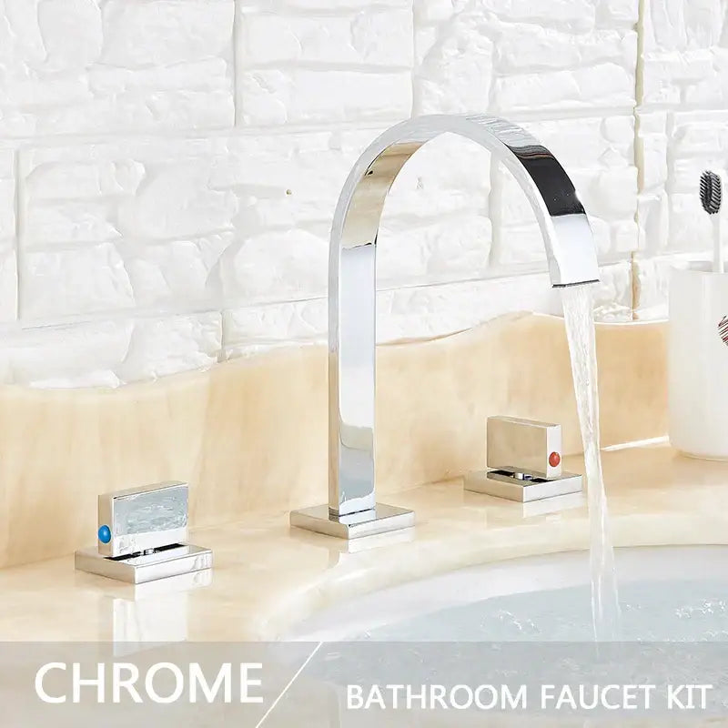 Modern gold arched dual handle basin faucet set with chrome finish and sleek rectangular handles for bathroom use