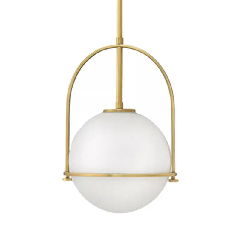 Modern gold arched glass bar pendant lamp with a sleek brass frame and frosted white spherical glass shade decorbites glass bar pendant