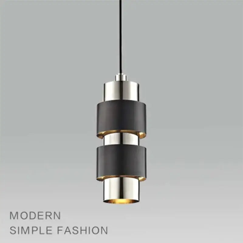 Modern gold arched decorbites glass bar pendant lamp with stacked black and brushed nickel rings and warm glow bottom light