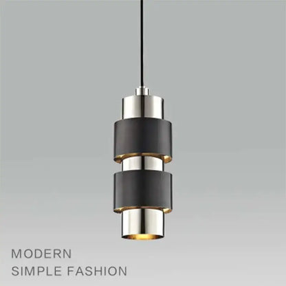 Modern gold arched decorbites glass bar pendant lamp with stacked black and brushed nickel rings and warm glow bottom light