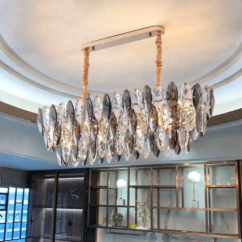 Modern gold ash crystal ceiling chandelier with sleek metallic frame and clear smoky gray faceted teardrop pendants decorbites ash crystal