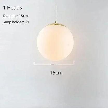 A sleek modern gold bean glass chandelier pendant light with frosted globe and polished brass fixture for living room