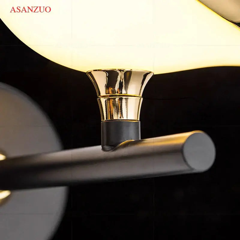 Modern gold bird led wall lamp featuring a gold-toned metallic fixture with a frosted glass shade for bedroom decor