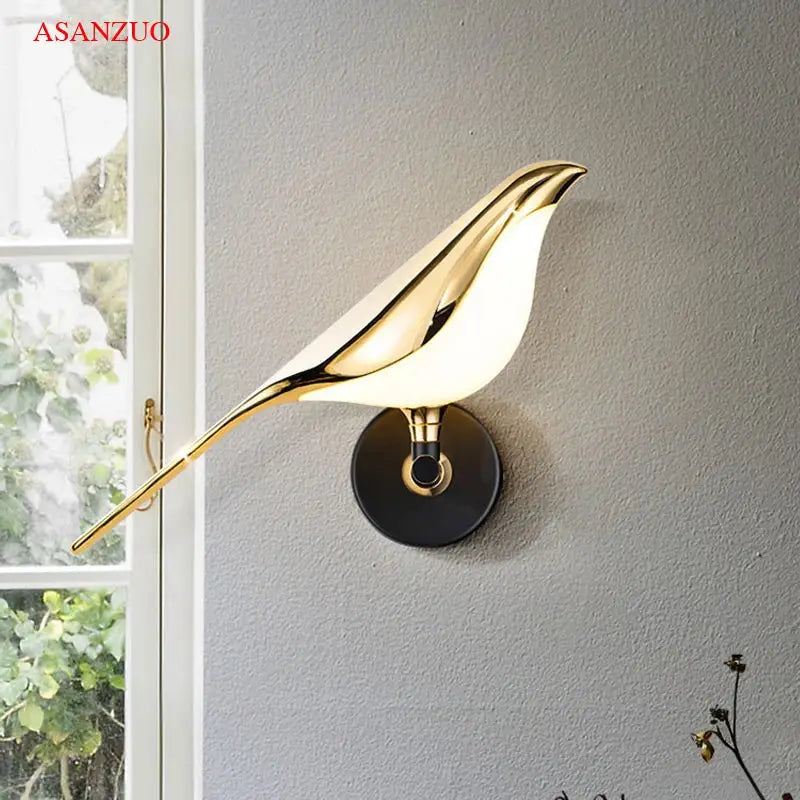 Modern gold-toned bird-shaped led wall lamp with sleek design and warm glow for bedroom decor and ambient lighting