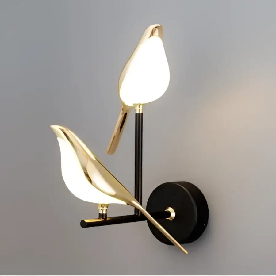 Modern gold bird led wall lamp featuring two pearlescent white light fixtures for bedroom decor lighting
