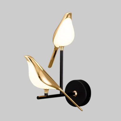 Modern gold bird led wall sconce with frosted glass shades and black metal accents for bedroom decorbites bird design