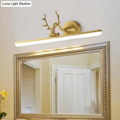 Modern gold and black antler vanity sconce light with gold-toned deer head and rectangular led bar design