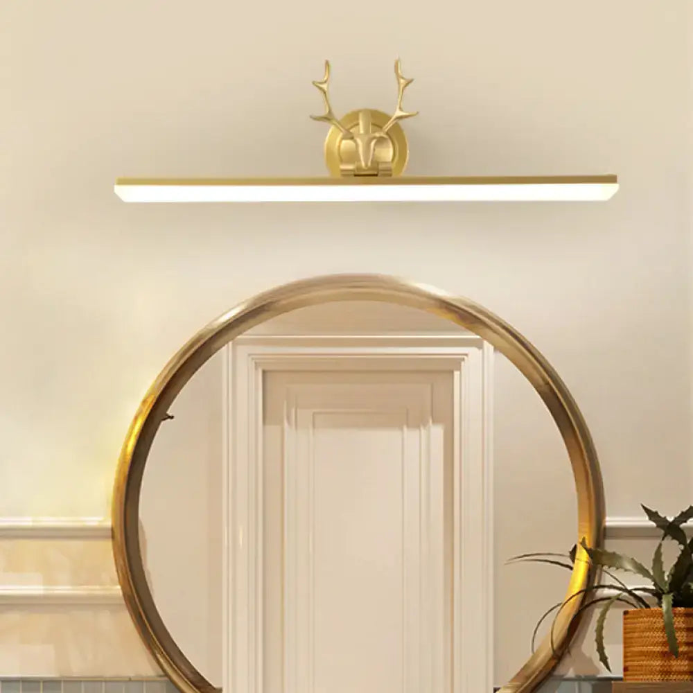 Modern gold and black antler vanity sconce light with a gold-toned deer head design and antlers for bedroom use