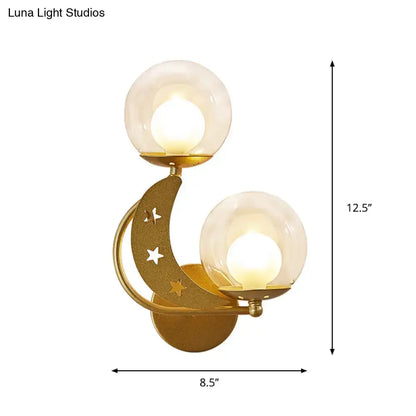 Modern gold crescent moon ball wall sconce with star cutouts and two frosted glass globe shades for bedroom lighting