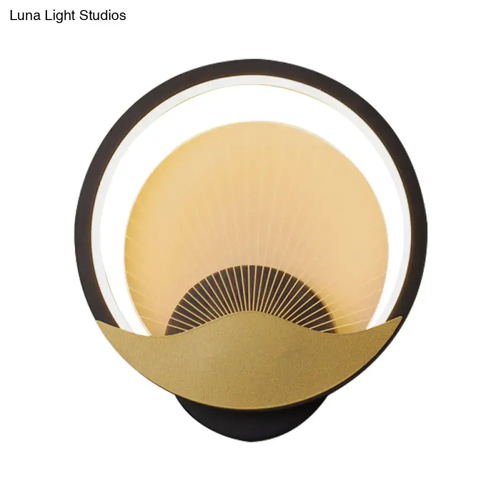 Modern gold and black circular led wall sconce with a black outer ring and illuminated crescent moon accent for bedroom lighting