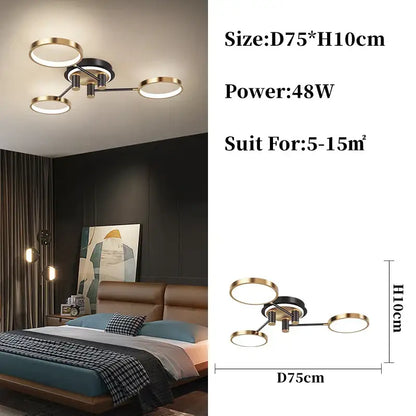 Modern gold black pendant light with four circular gold-toned rings and black hub for contemporary living room decorbites design