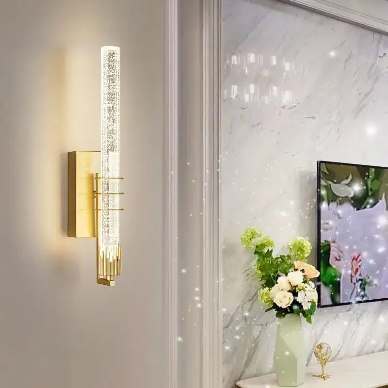 Modern gold and black crystal led wall sconce with vertical crystal encrusted glass tube and metallic accents for decorbites crystal led wall decor