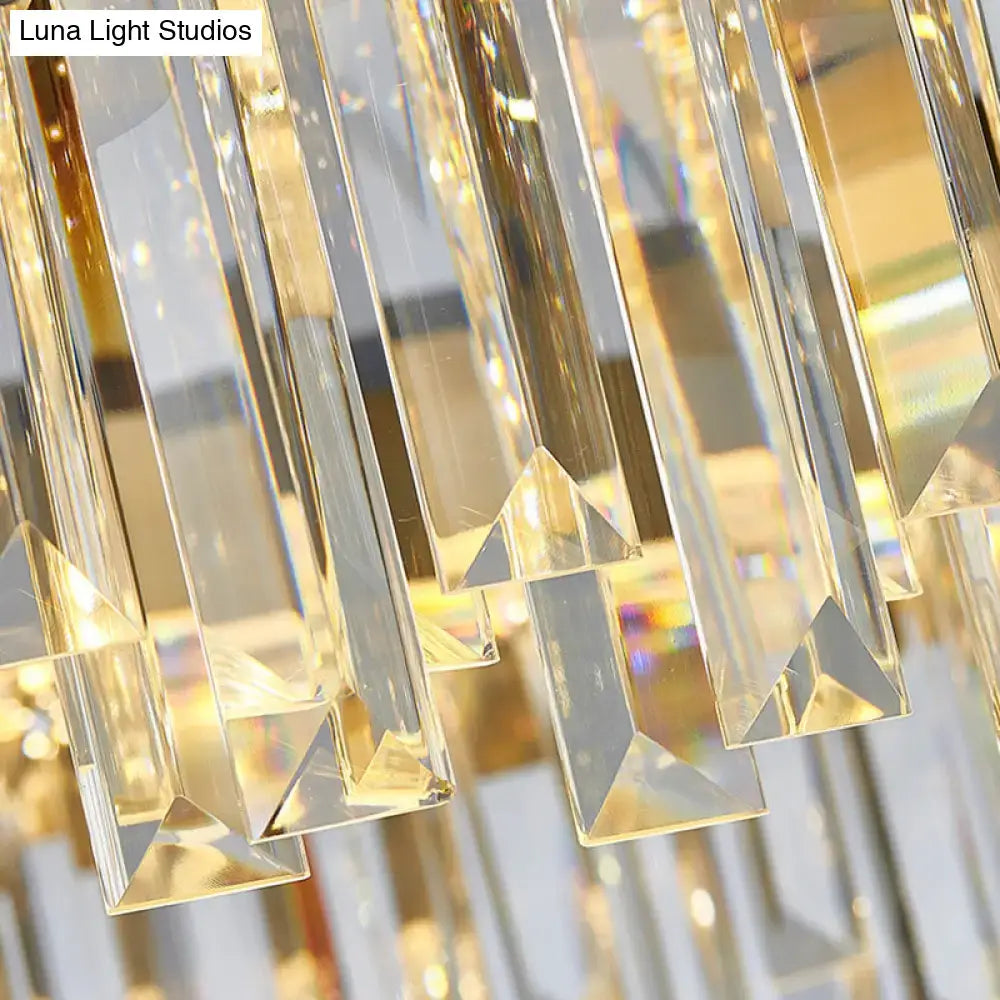 Clear faceted crystal prisms hang in a traditional gold DecorBites™ rod hanging lamp with 10 heads