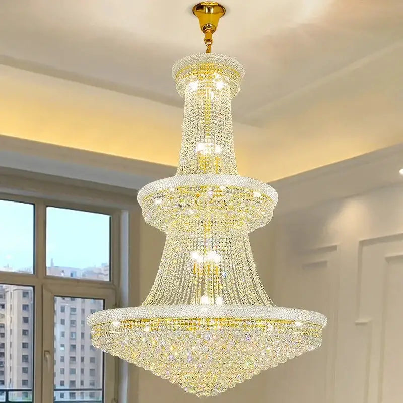 Modern gold and black crystal staircase pendant light with sparkling clear crystals and polished brass metal finish