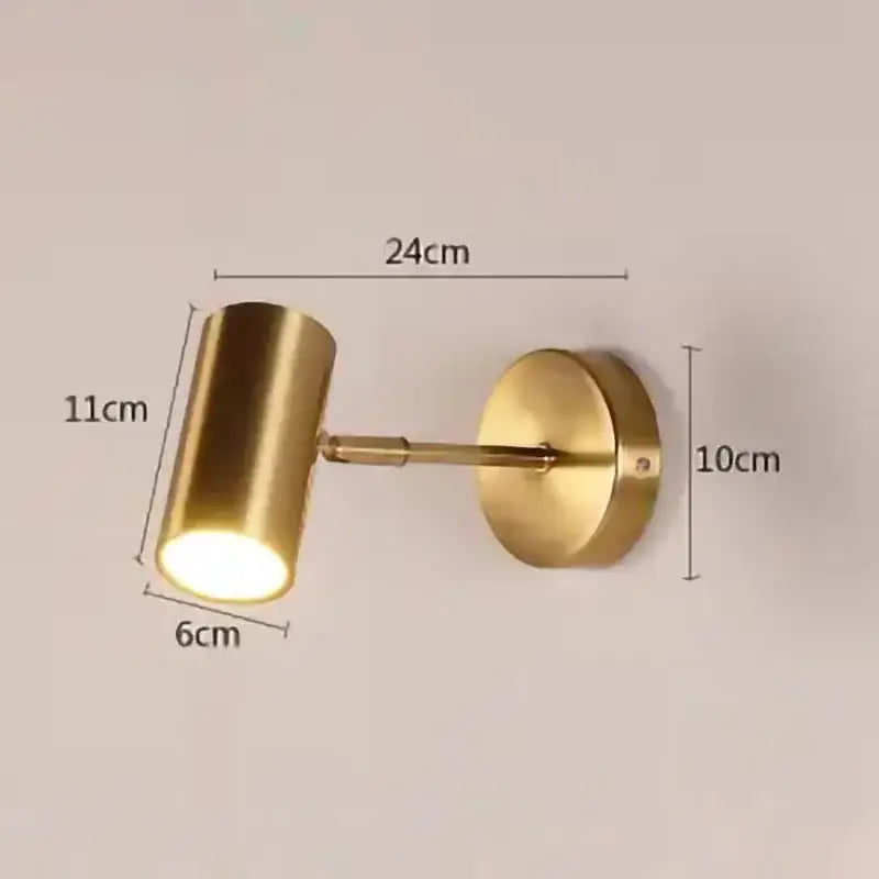 Brass-finished wall lamp with cylindrical head and circular base modern gold led wall decorbites gold led fixture