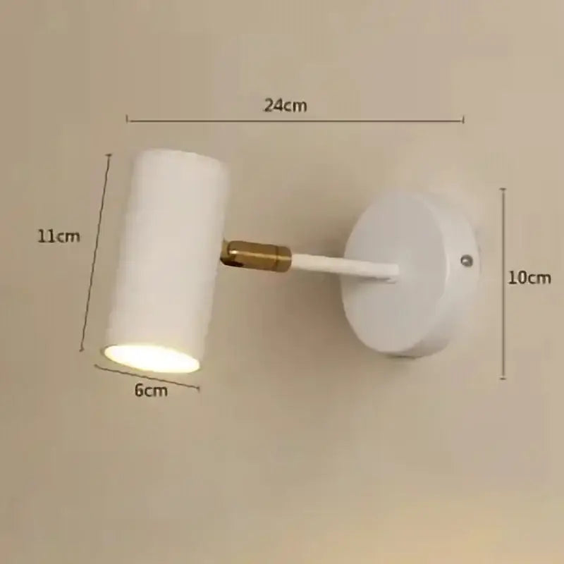 Modern gold and black cylindrical led wall lamp with white spotlight and brass arm by decorbites gold led wall lamp