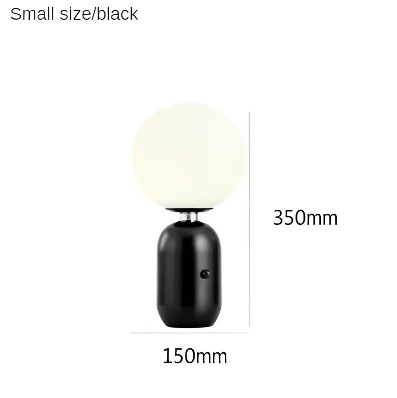 Black desk lamp with frosted glass ball led globe and sleek cylindrical base from decorbites glass ball collection