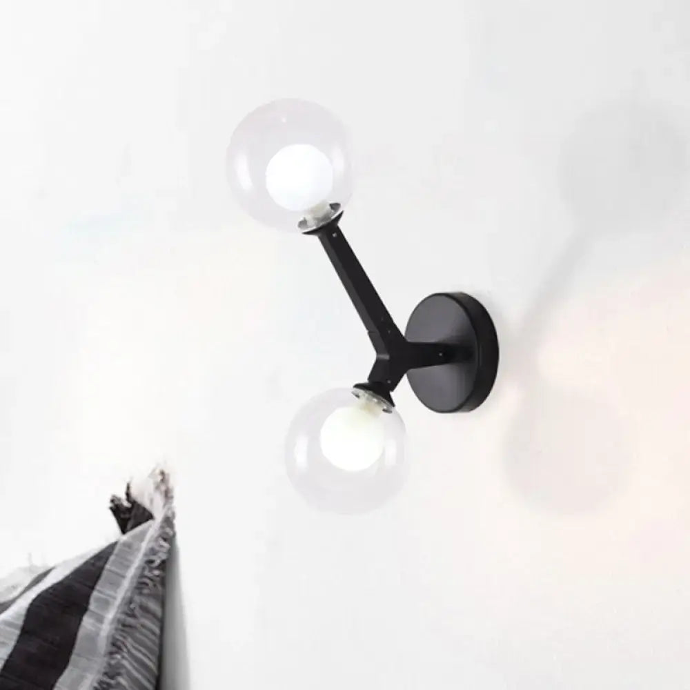 Black wall lamp with double globe glass globes in modern gold and black design for corridor lighting