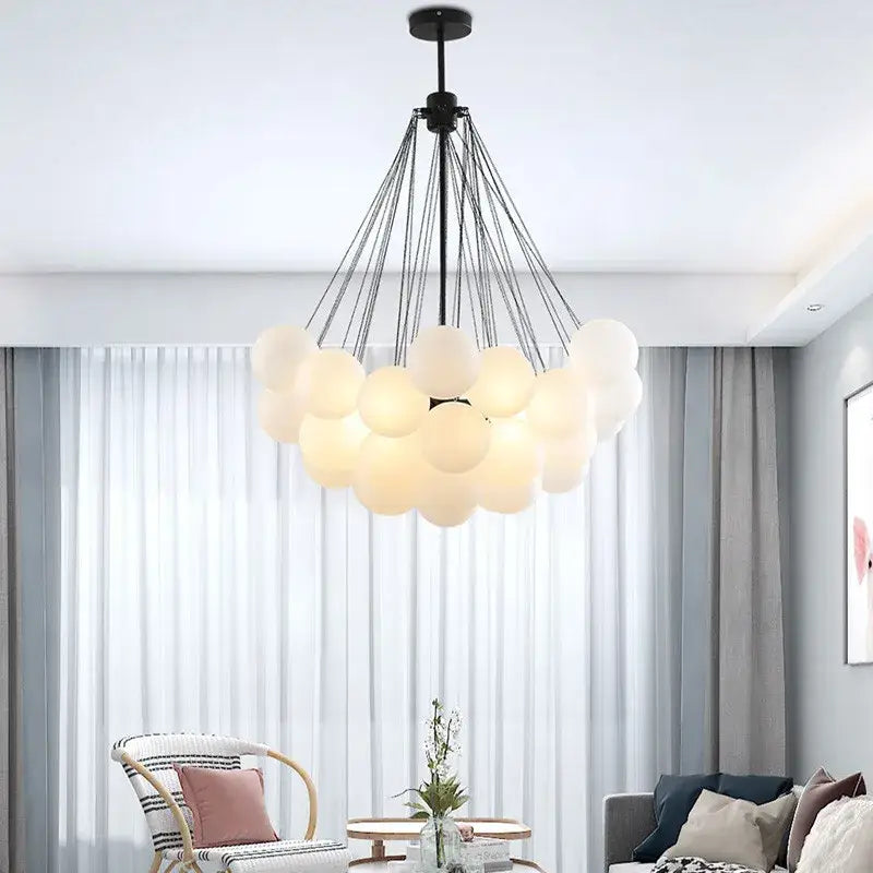 Modern gold and black frosted glass ball chandelier with black metal frame and frosted glass spheres for dining room decorbites frosted glass
