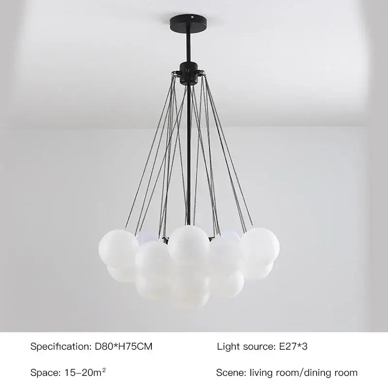 Modern black metal chandelier with frosted glass ball shades in a cloud-like cluster for dining room decorbites frosted glass