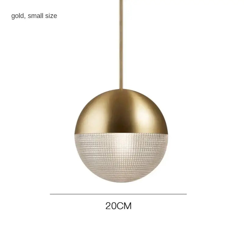 A sleek modern gold pendant light with a decorbites glass ball led design for bedroom decor