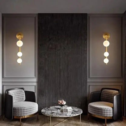 Modern gold-toned wall lights with three frosted glass ball bulbs decorbites glass ball wall for living room decor