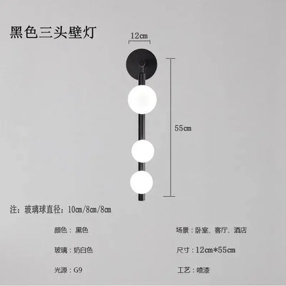 Black three-head wall lights with frosted white glass spheres and modern design for decorbites glass ball wall decor