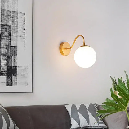 Modern gold wall lamp with curved arm and frosted glass globe decorbites glass ballight led bedroom sconce