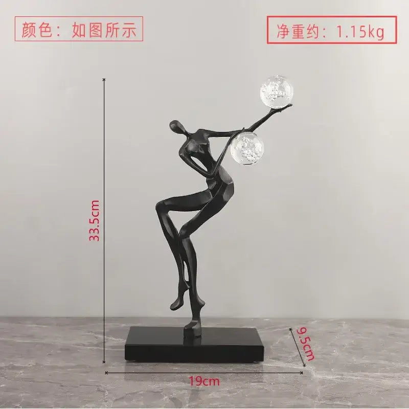 Black abstract golden man crystal ball sculpture with two clear spheres for elegant living room decor by decorbites