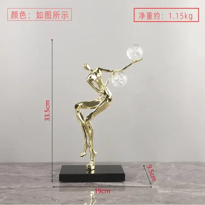 Golden man metallic figurine balancing two crystal balls on black base modern gold and black living room decorbites crystal ball sculpture