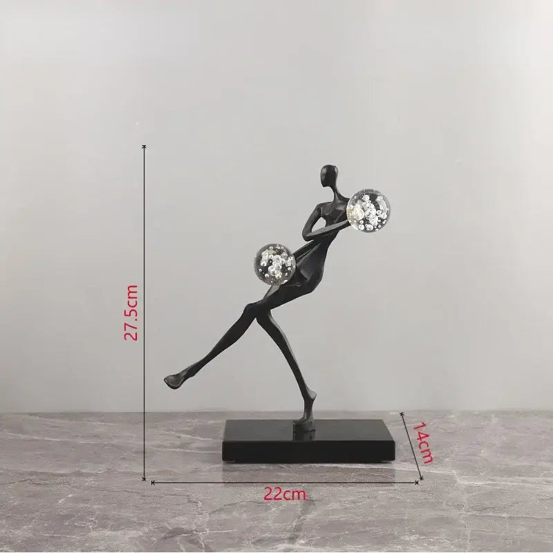 Black abstract golden man figurine sculpture holding two crystal balls on rectangular base for living room decorbites decor