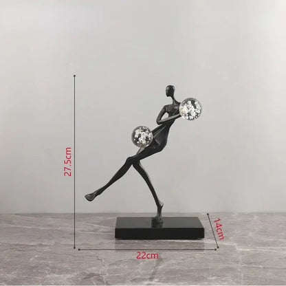 Black abstract golden man figurine sculpture holding two crystal balls on rectangular base for living room decorbites decor