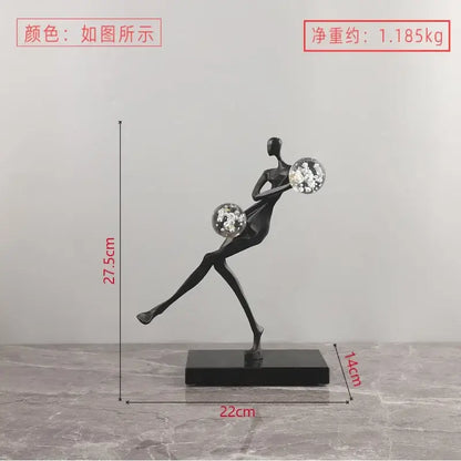 Black abstract dancer figurine holding two sparkling crystal balls on a base modern decorbites golden man sculpture