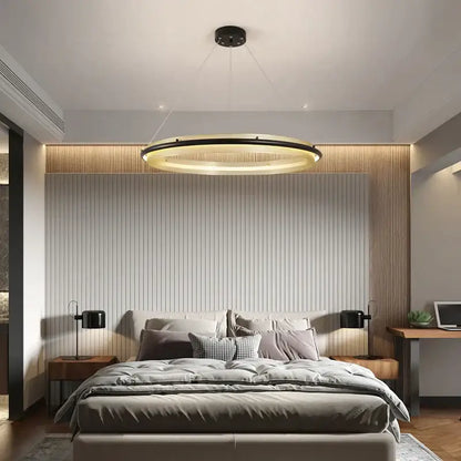 Modern gold and black honeycomb round pendant light with sleek black ring and warm inner glow for dining room decorbites pendant light