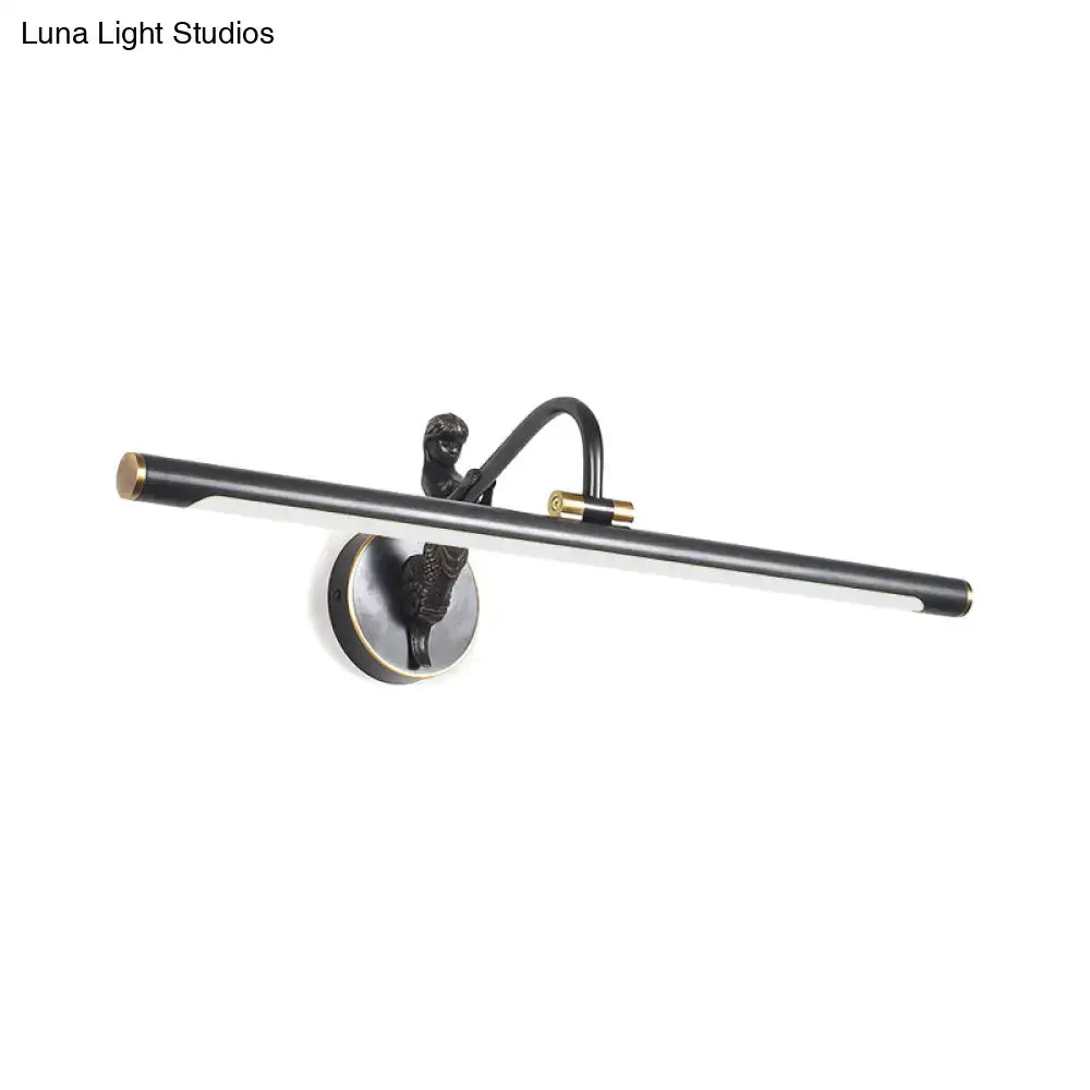 Modern gold and black led wall sconce with a black and brass-toned fixture and sculptural figure on curved arm