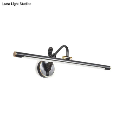 Modern gold and black led wall sconce with a black and brass-toned fixture and sculptural figure on curved arm