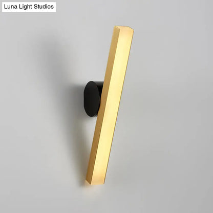 Modern gold and black led wall sconce with rectangular design and black circular mounting base for living room fixture width