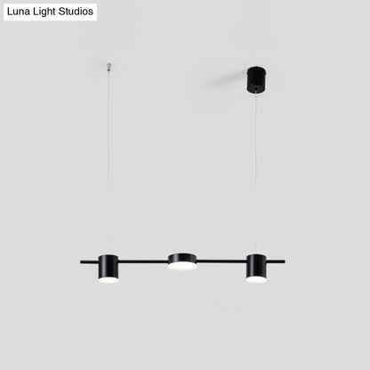 Decorbites modern linear metallic chandelier light with three black cylindrical pendant heads and warm white light
