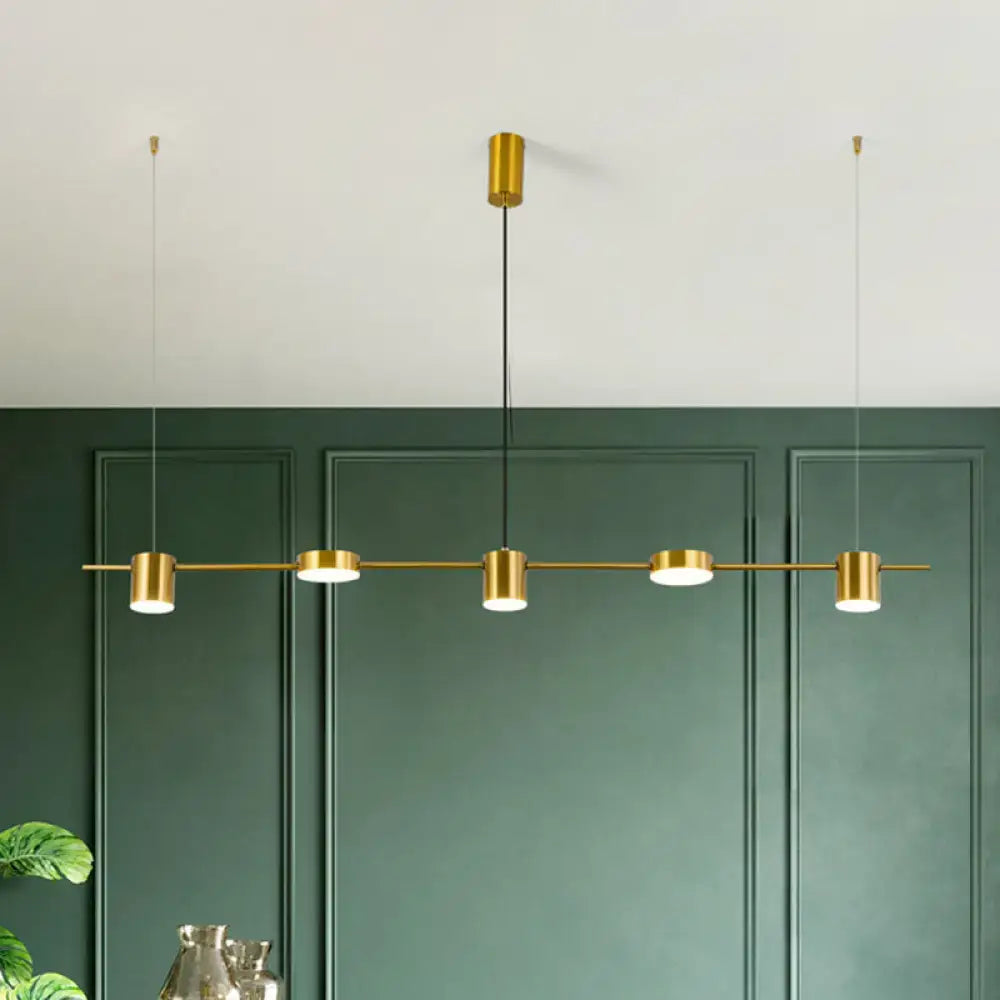 DecorBites™ modern linear metallic chandelier light with gold-toned cylindrical fixtures and warm white light black gold design