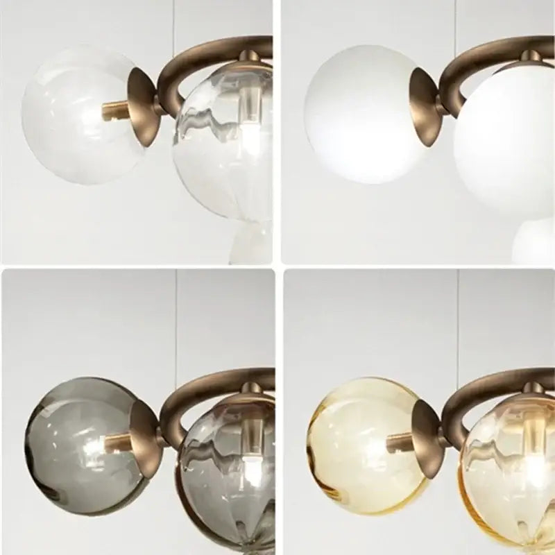 Modern gold black magic bean ceiling chandelier with brass finish and spherical glass shades in clear, frosted white, smoky gray, and amber hues