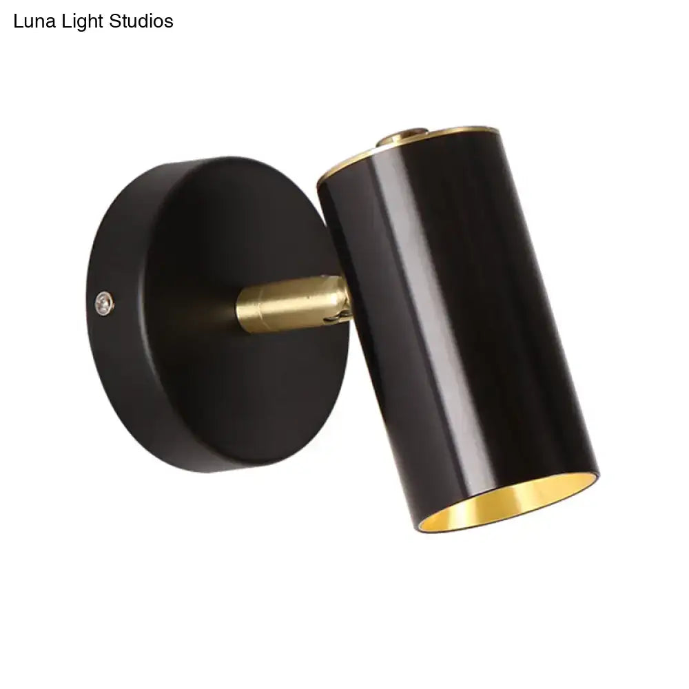 Modern gold and black metallic tube led light bedside wall sconce with cylindrical shape and matte finish