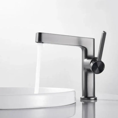 Modern gold and black decorbites basin faucet with matte black finish and sleek single lever handle for bathroom use