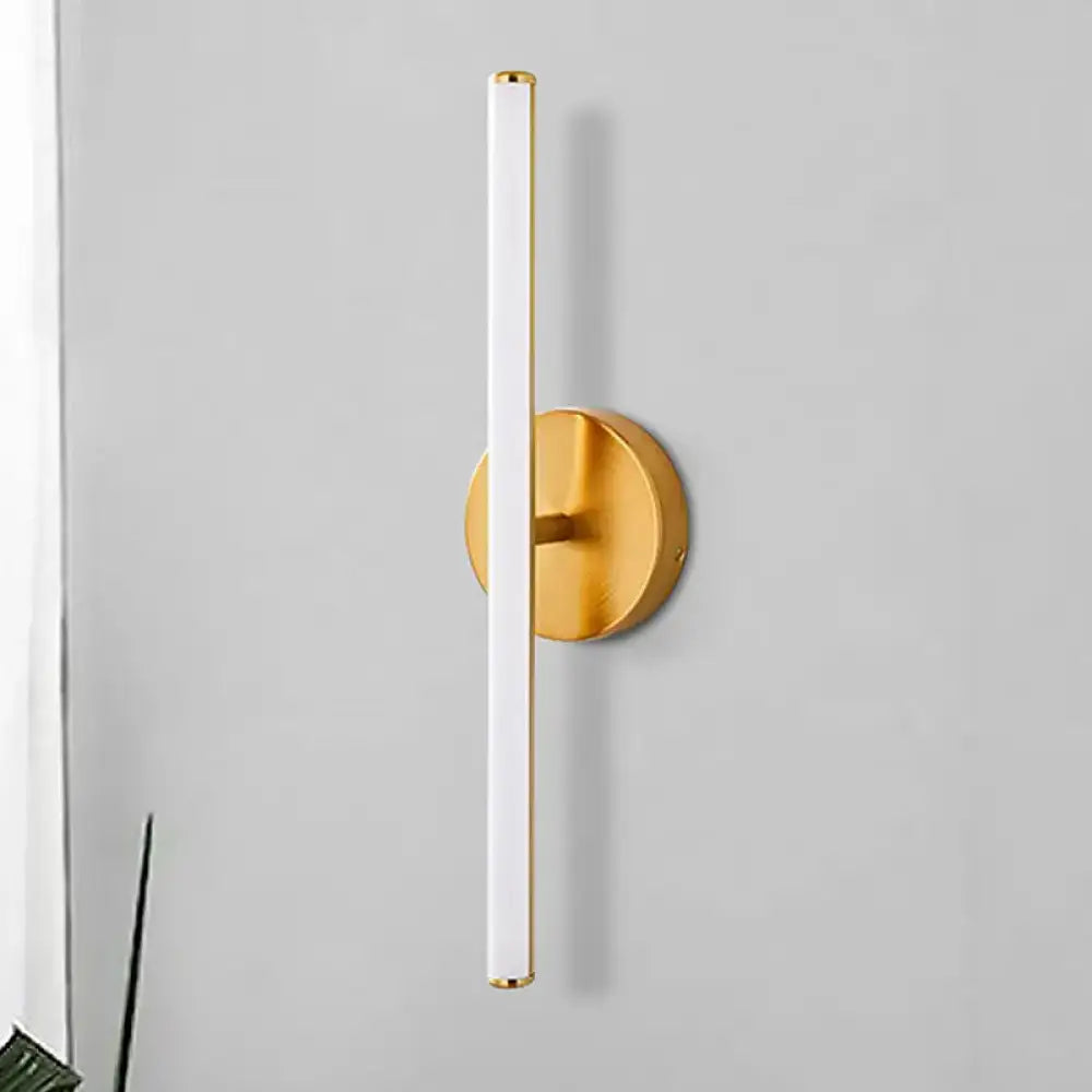Modern gold and black minimalist wall sconce featuring a gold finish and sleek white cylindrical wall light tube