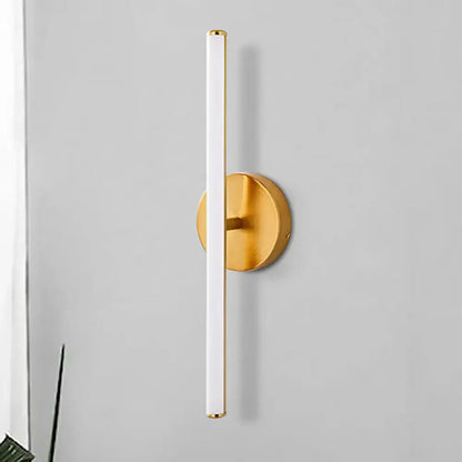 Modern gold and black minimalist wall sconce featuring a gold finish and sleek white cylindrical wall light tube