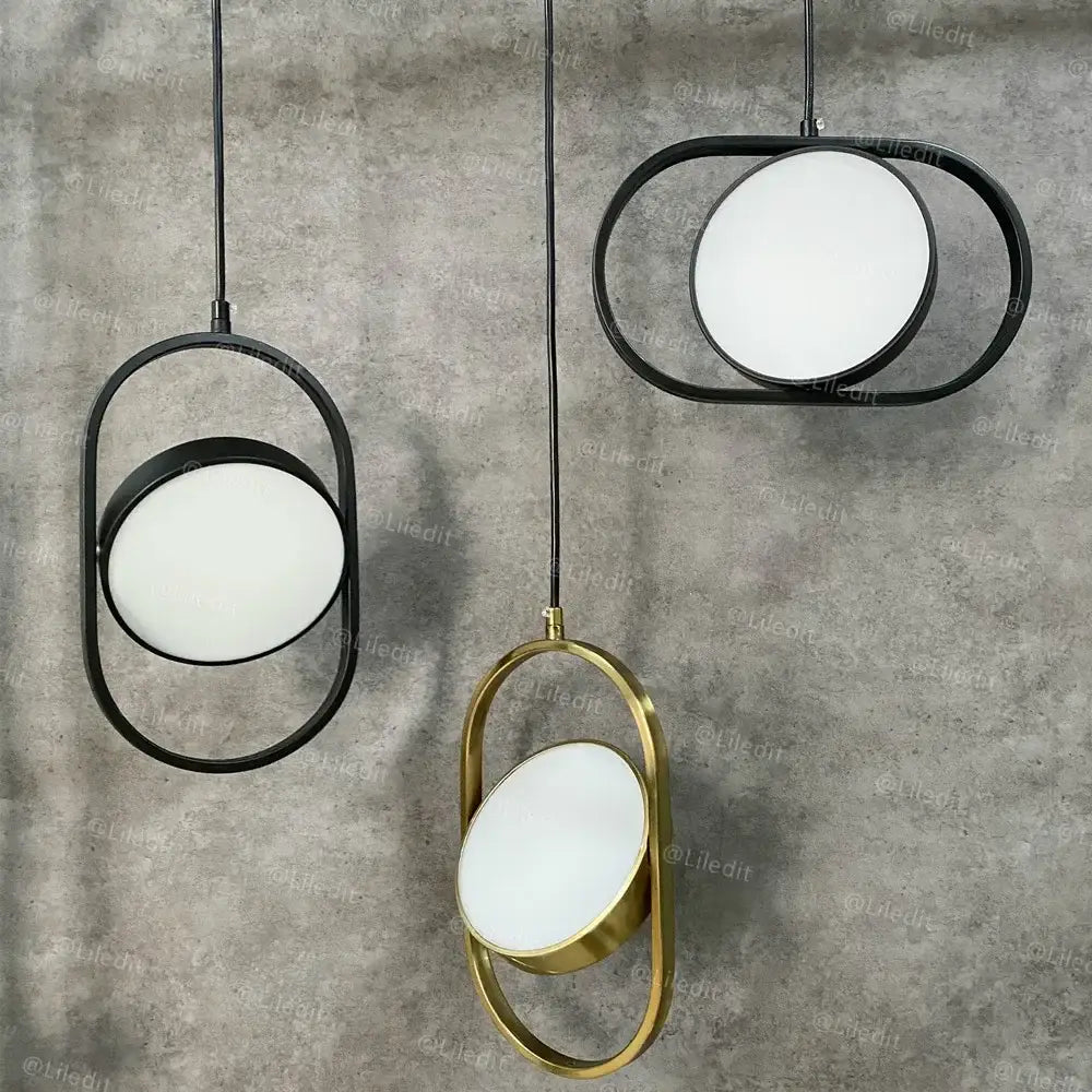 Modern gold and black pendant lights with sleek metal frames and circular frosted glass diffusers for kitchen decorbites gold pendant